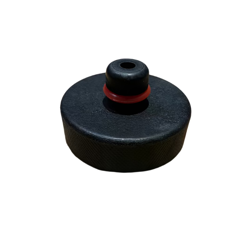 Tesla jacking puck with washer to hold it in place.